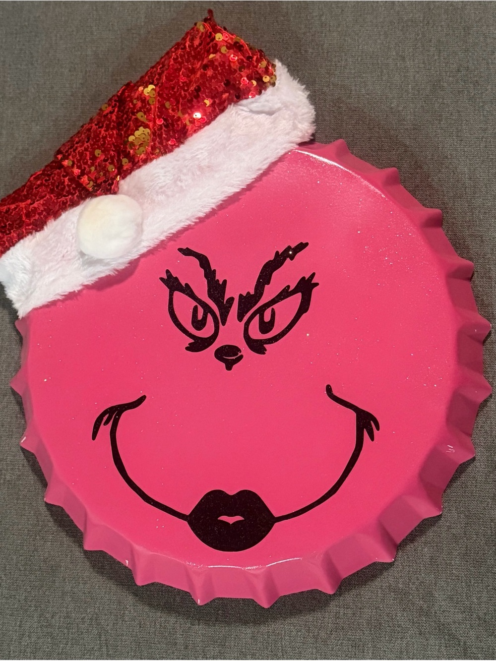 Grinch bottle cap sign measures 13.5” x 13.5”